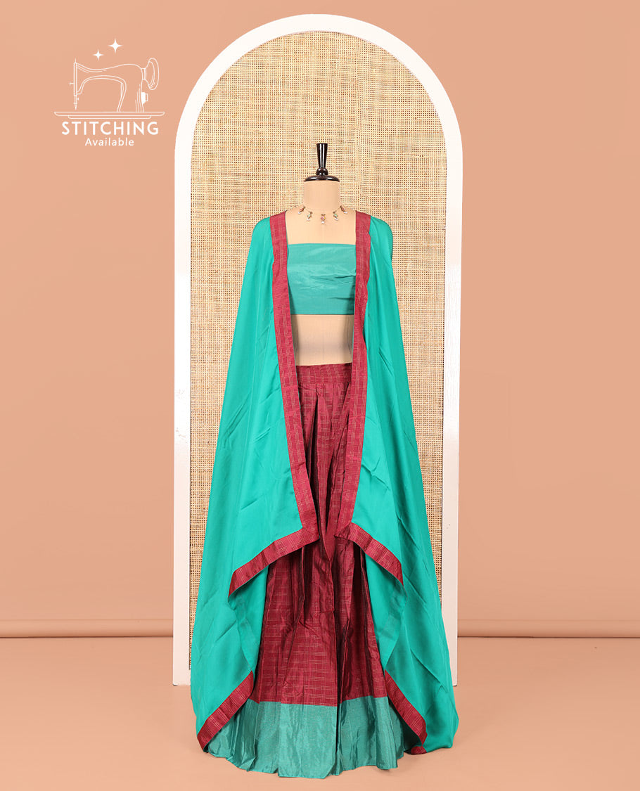 Magenta and Green Checked Taffeta Silk Half-Saree, Complemented by Contrast Sparsely Striped Border, Paired with a Contrast Blouse, and Comes with Subtle-Bordered Satin Georgette Dhavani