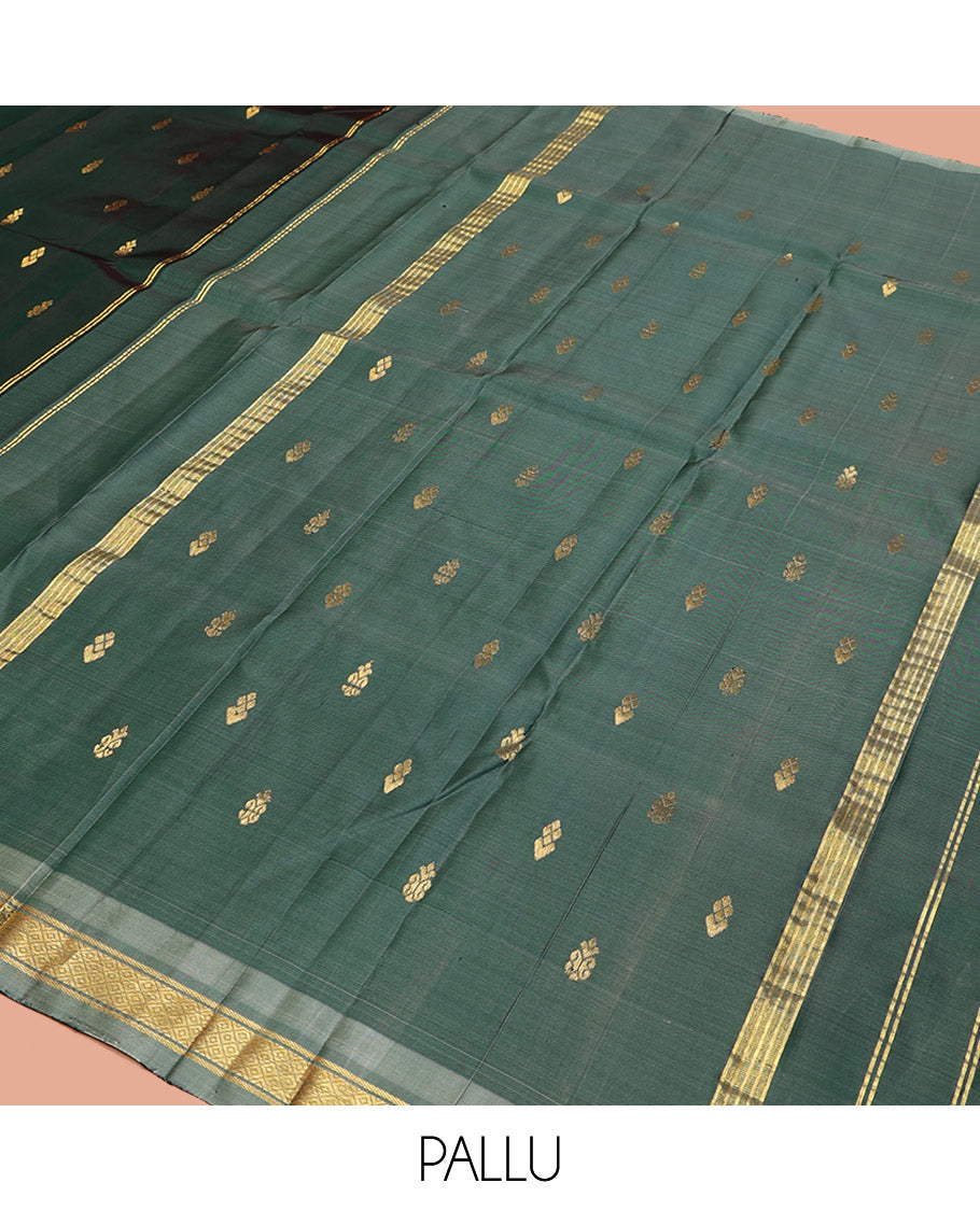 Green Kanchipuram Silk Saree, Embellished with Zari Buttas, a Contrast One-Sided Border of Mayil Kann Designs, a Zari-Design Pallu, and No Blouse