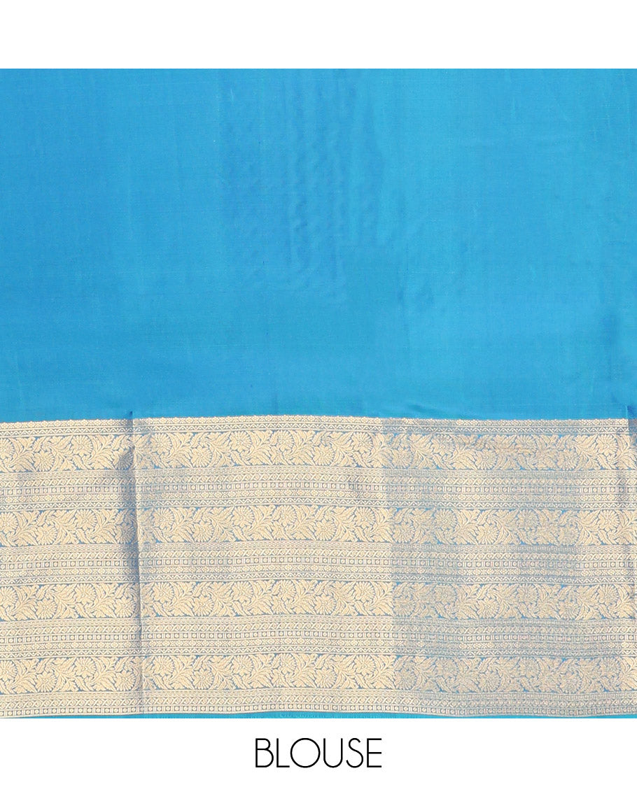 Scintillating Blue Vasundhara Lite-Silk Mix Saree, Gleamed Up with Zari on Its Body, Highlighted by Thazampoo Rekku Border of Neli, Paisa, Cross Kamalam, and Kodi Visiry Designs, a Grand Geometric-Patterned Pallu, and Paired with a Matching Blouse