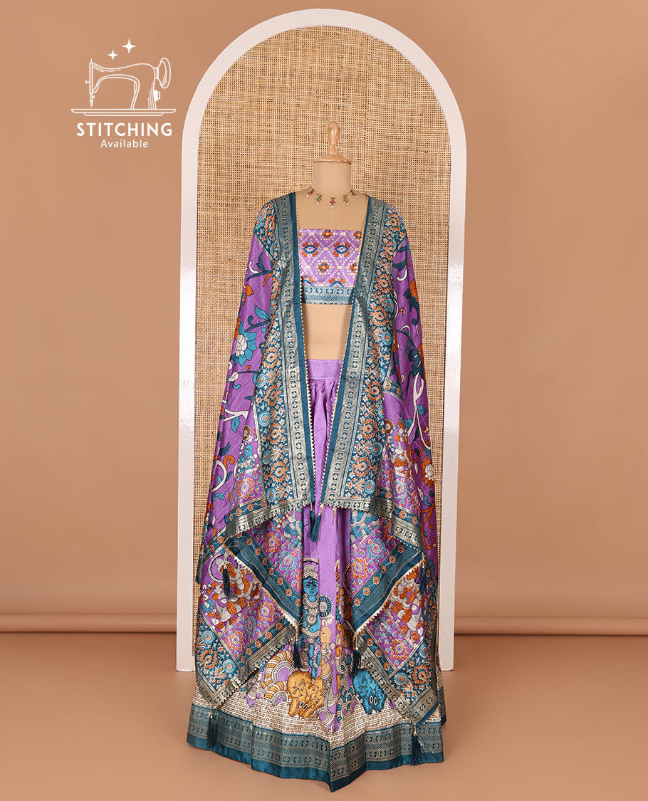 Purple semi-tussar half-saree, kalamkari human figurines printed with a contrast geometric bordered skirt, patola printed blouse, and kalamkari floral vine printed dhavani