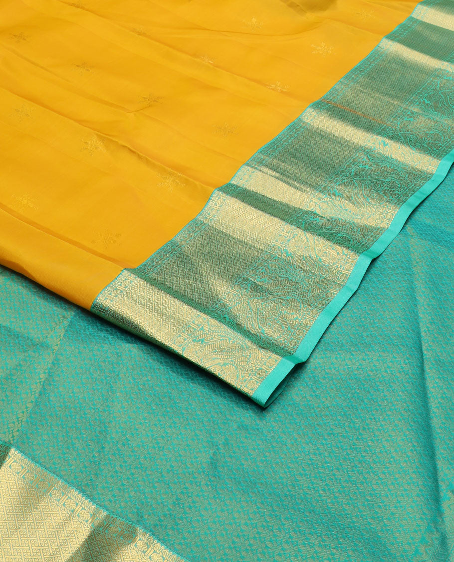 Yellow zari buttas vasundhara silkmix saree,contrast intricate pallu & border of poun,banaras,paayadi kann,mayil & yaali