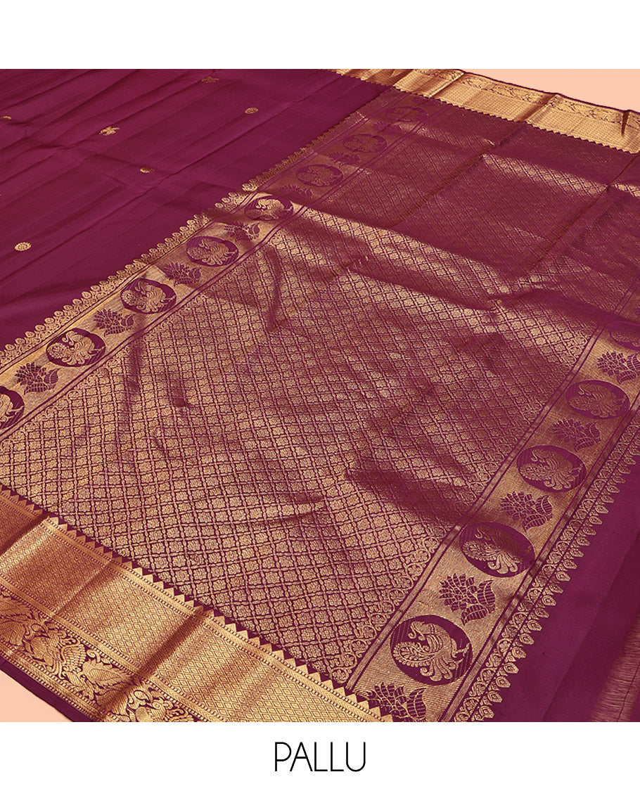 Maroon Kanchipuram Silk Saree, Accentuated with Kuthirai Buttas All Over Its Body, Highlighted by a Zari Border of Rekku, Muthu, Kathir, Mayil Kann, and Mayil Designs, Grand Jaal Pallu, and Paired with a Matching Blouse