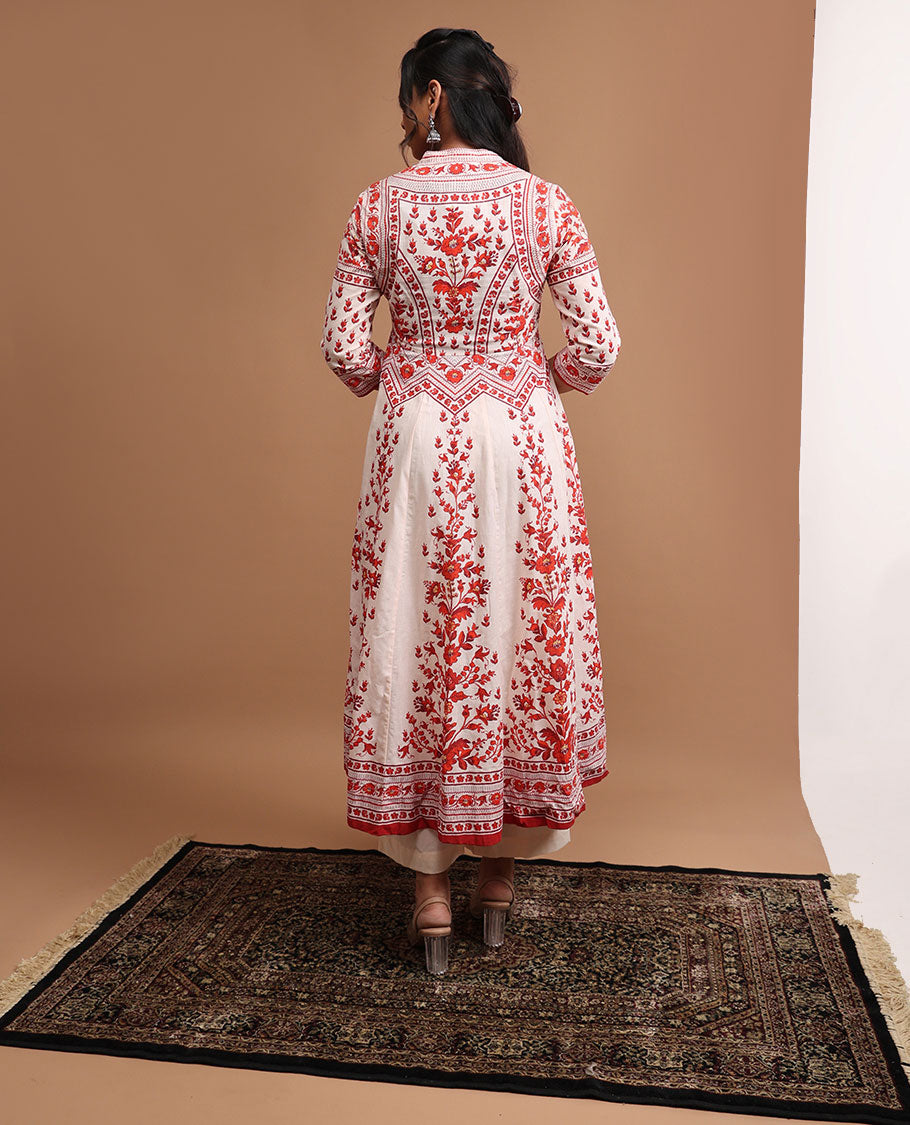 White floral design v neck, 3/4 th sleeve, below knee lenght top with straight pants