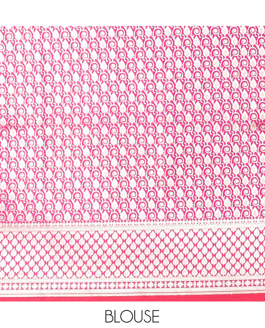 Rani Pink Banarasi Nylon Saree, Opulently Embellished with Zari Designs, Highlighted by a Traditional Zari Border, Intricate Pallu, and a Matching Blouse