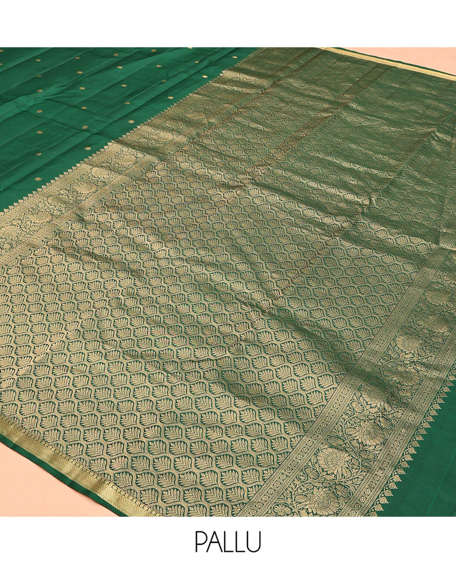Green Vasundhara Silk Saree, Majestically Detailed with Zari Buttas and Mayil-Yaanai Buttas, a Subtle Zari Border, Jaal Pallu, and a Matching Blouse