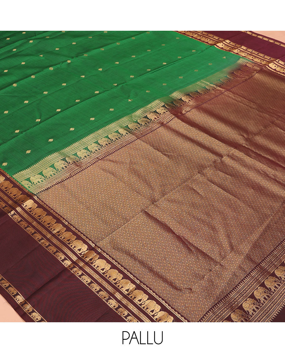 Green Vasundhara Silk Saree, Elevated with Zari Buttas All Over Its Body, Complemented by a Contrast Rettai Pettu Border of Yaanai Designs, Grand Jaal Pallu, and Paired with a Contrast Blouse