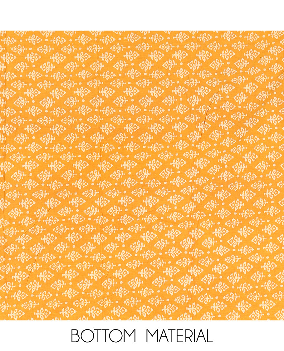 Black-Yellow Cotton Material Chudidar Features Batik-Printed Top, a Contrast-Printed Bottom, Batik-Printed Dupatta