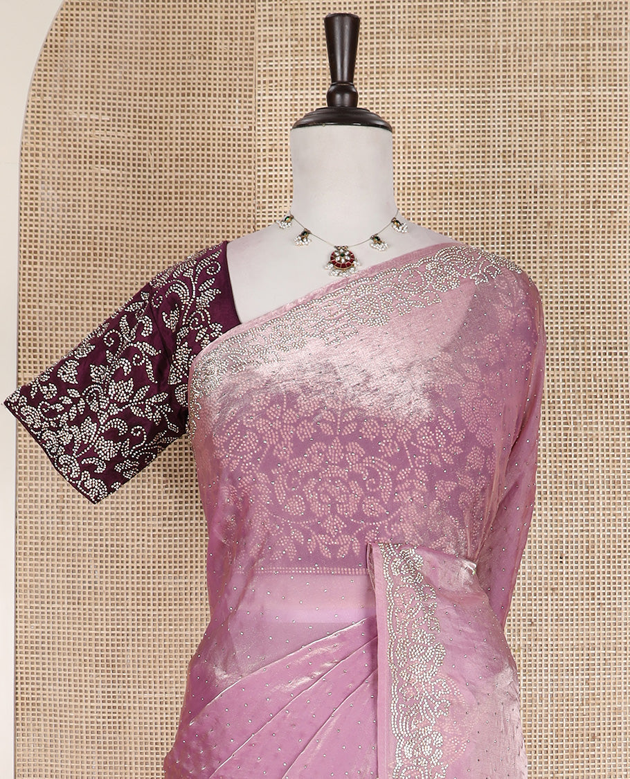 Pink stone work designer saree, micro-stone work border, and a contrast half-sleeve blouse of floral vine design in micro stones