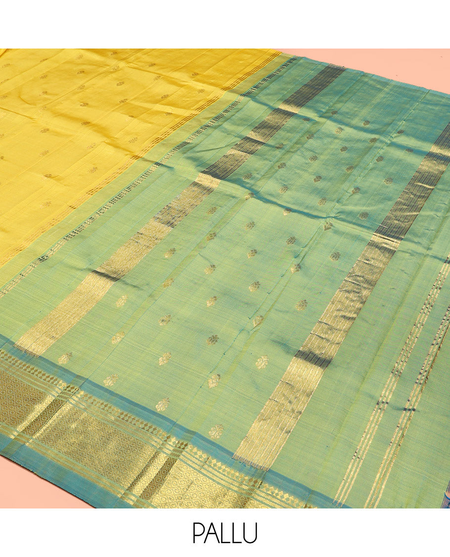 Yellow Kanchipuram Silk Saree, Subtly Sparkled with Zari Buttas, Contrast One-Sided Border of Paneer Sombu, Banaras, and Mayil Kann, Zari Design Pallu, and No Blouse