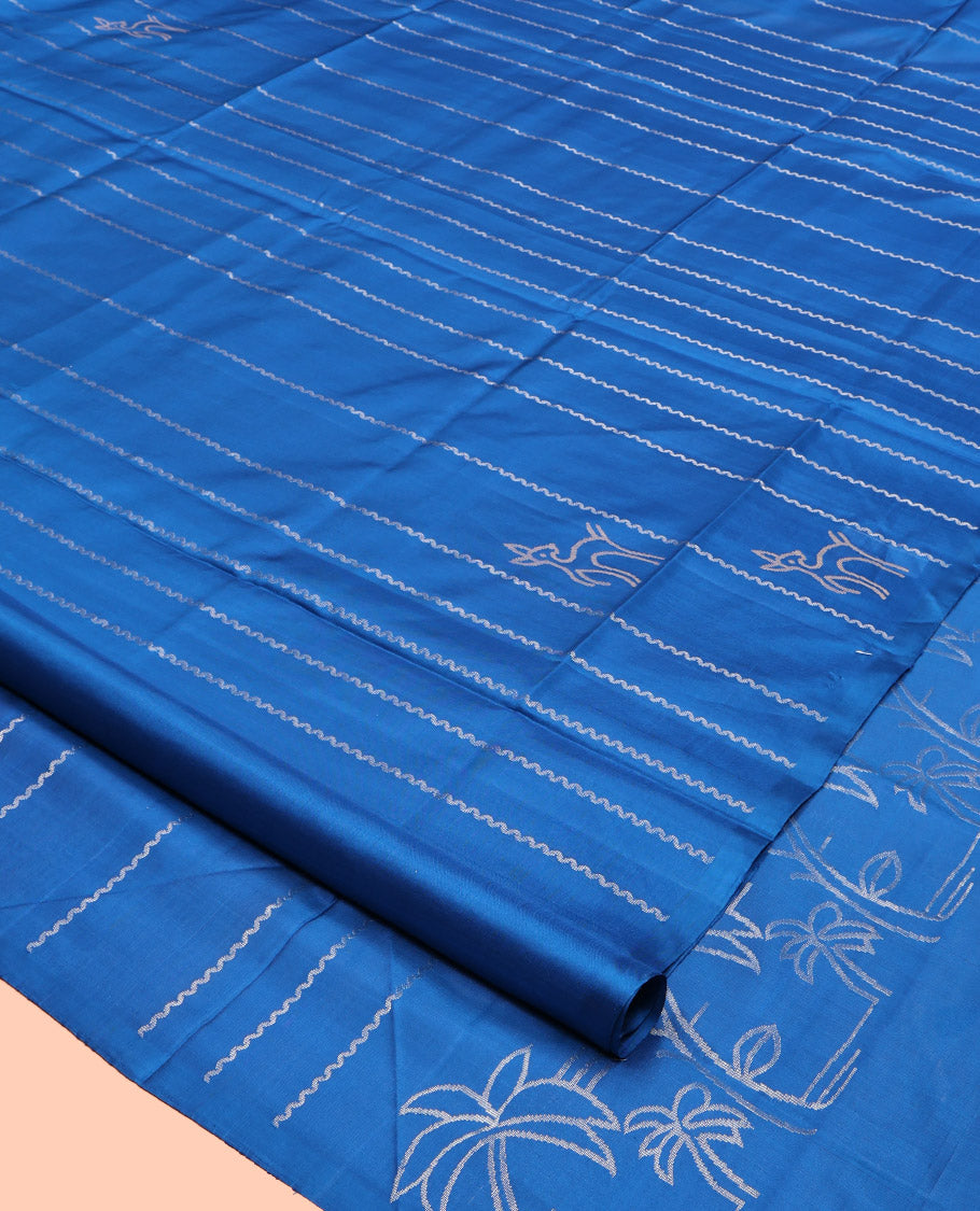 Borderless Blue Mayuri Soft Silk Saree, Adorned with Zig-Zag Stripes and Deer Buttas, a Pallu of Coconut Tree Designs, and a Matching Blouse