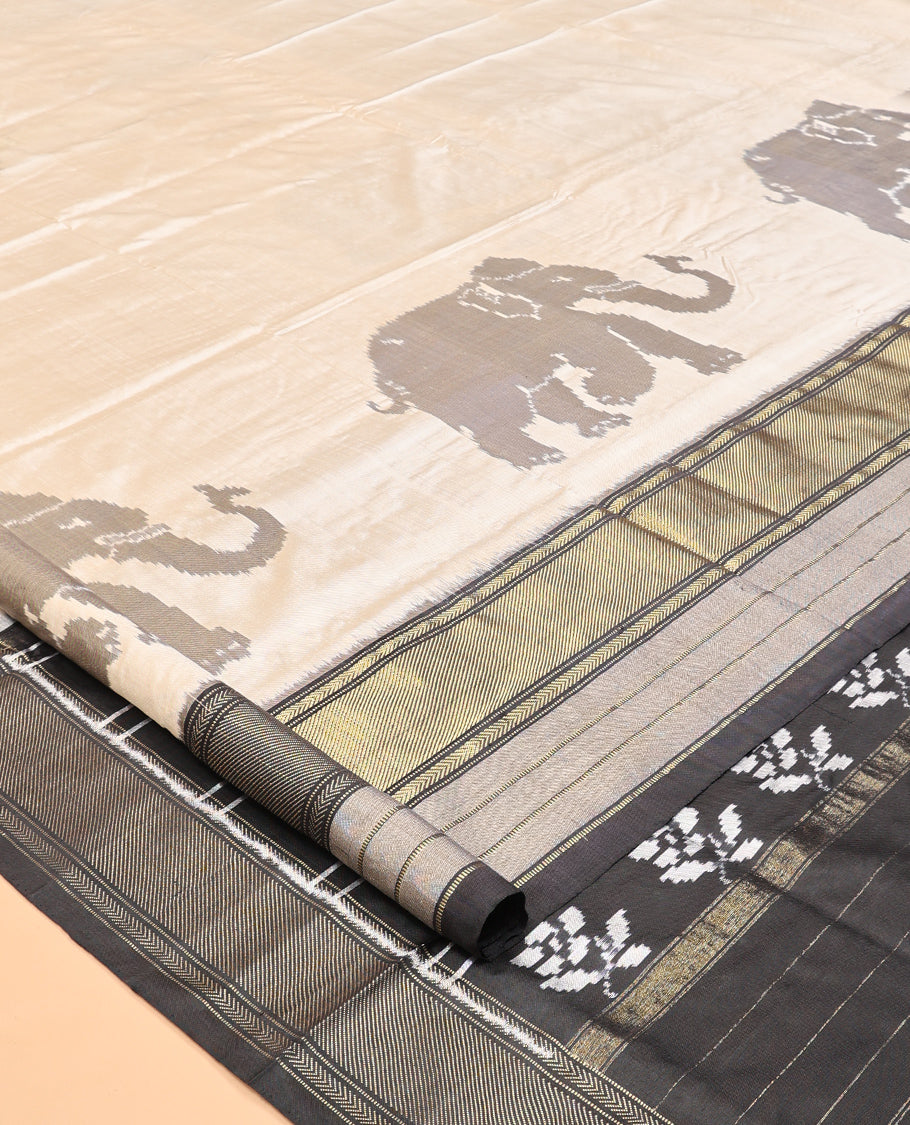 Cream Pochampally Ikat Saree, Adorned with Elephant Motifs, Complemented by a Contrast Traditional Zari Border, Ikat Pallu, and a Contrast Blouse