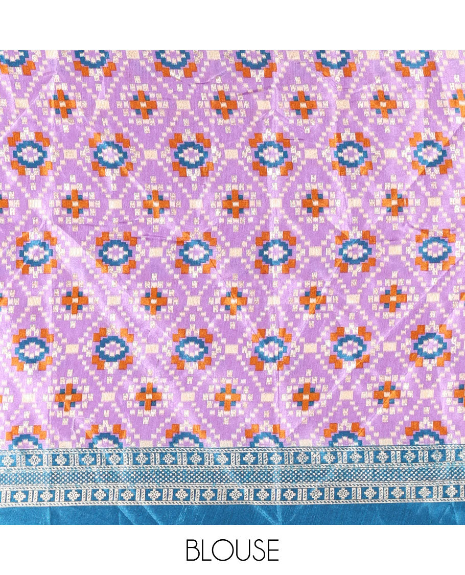 Purple semi-tussar half-saree, kalamkari human figurines printed with a contrast geometric bordered skirt, patola printed blouse, and kalamkari floral vine printed dhavani