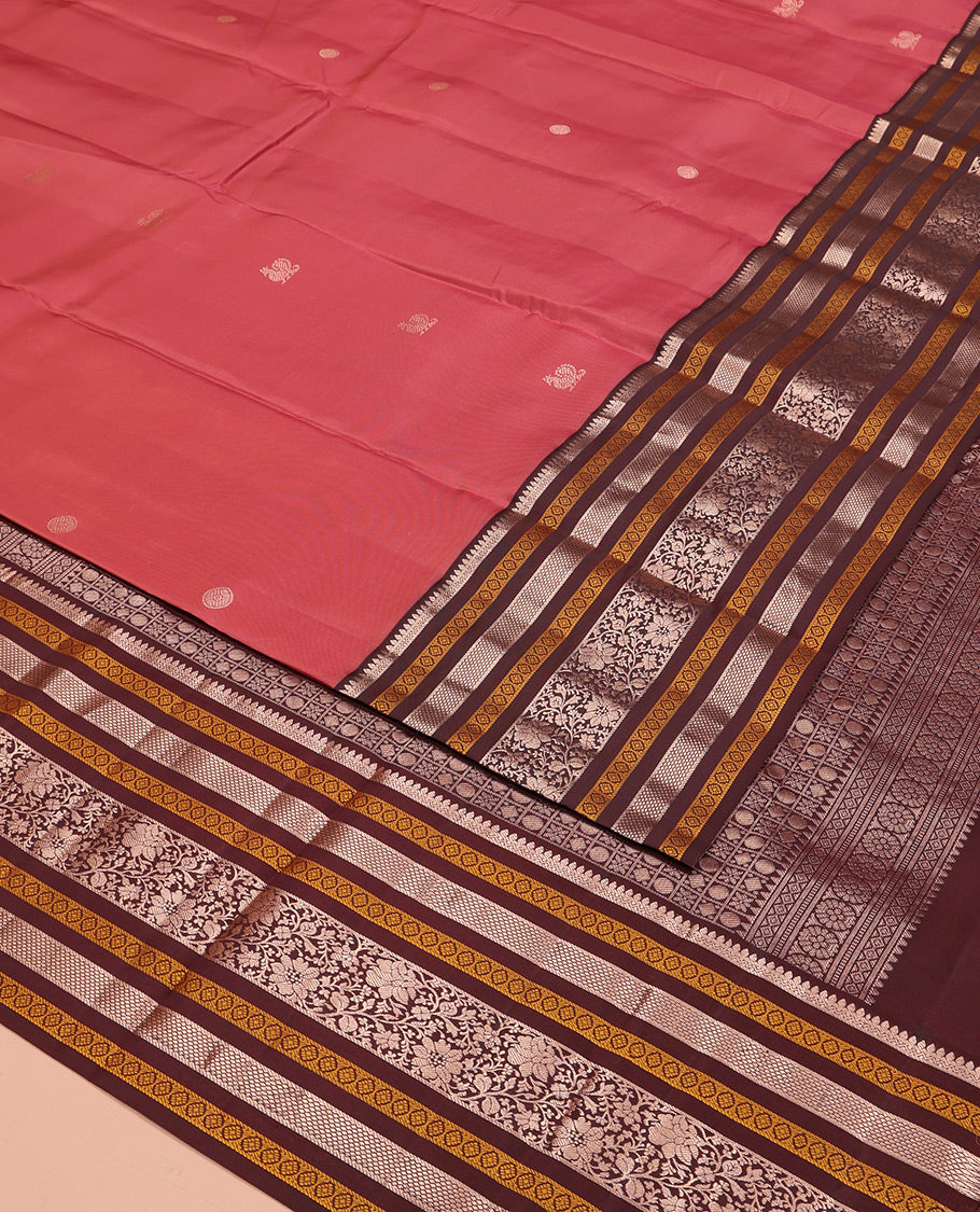 Pink Vasundhara Silk Saree, Embellished with Mayil and Chakram Buttas All Over Its Body, Complemented by a Contrast Border of Thilakam, Neli, Laddu Kamalam, and Kodi Visiry Designs, Grand Pallu of Butta Enclosed Checks, and Paired with a Contrast Blouse