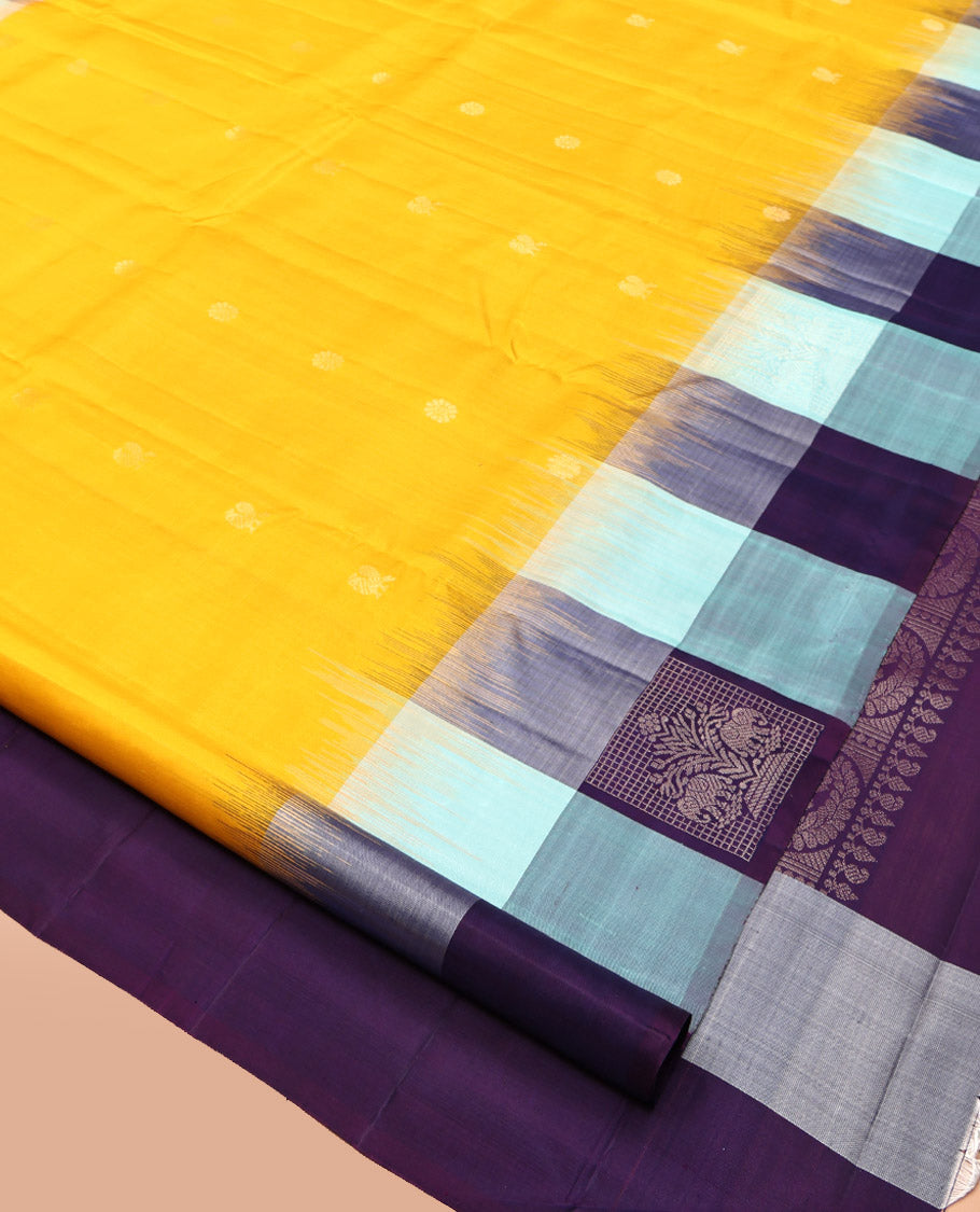 Yellow Kanchipuram Silk Saree, Sparsely Sparkled with Mayil-Chakram Buttas, Complemented by a Contrast Checked Yaanai Motif Border, Floral Pallu, and a Contrast Blouse