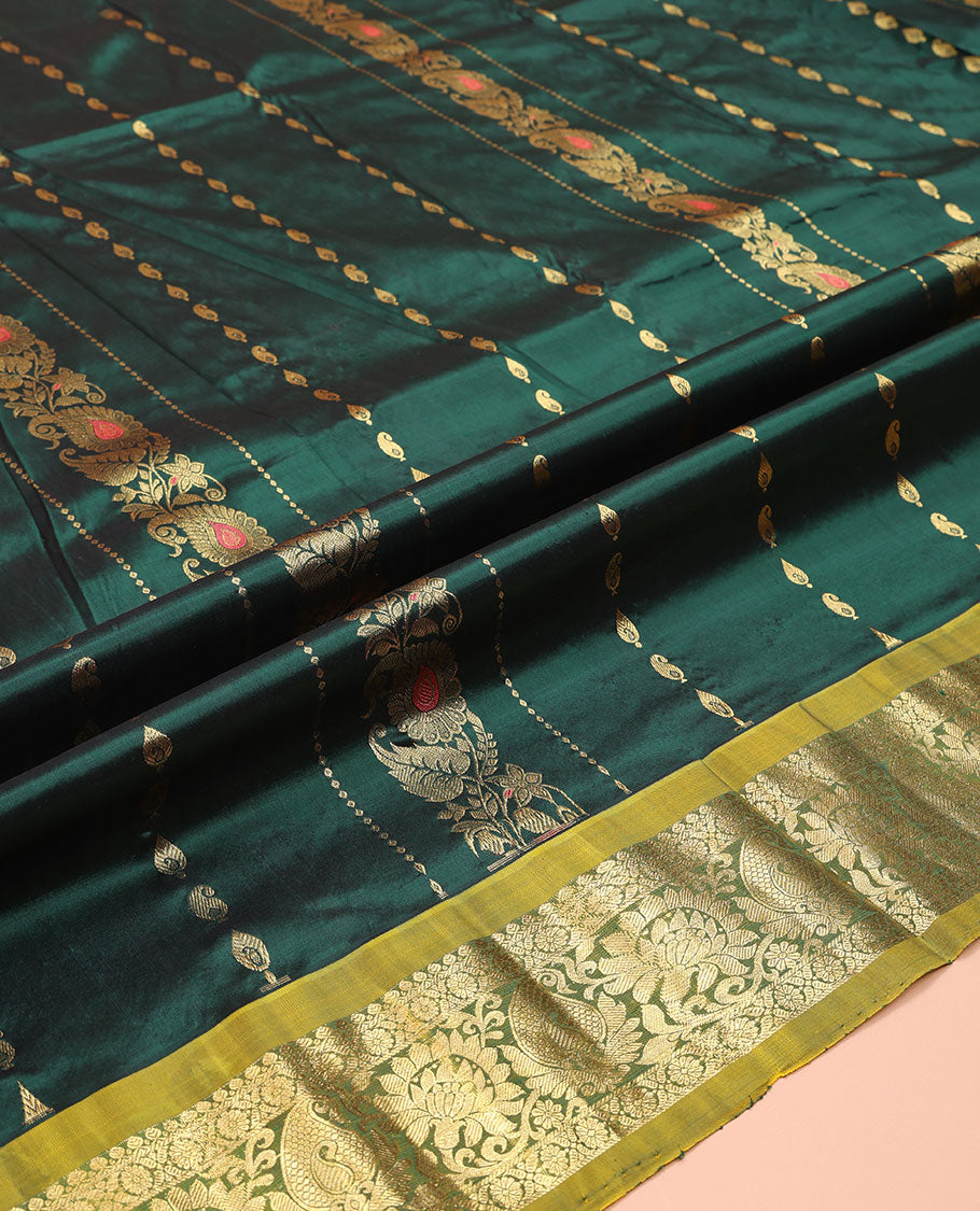 Green Pure Silk Half-Saree, Accentuated with Zari Buttas on Its Body, Complemented by a Contrast Floral and Paisley Design Border, Complemented by a Contrast Blouse, and Paired with a Contrast Dhavani of Jaal Designs