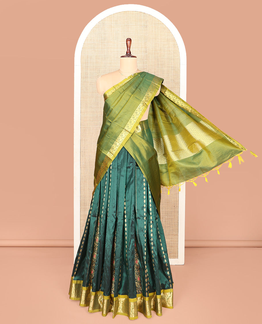 Green Pure Silk Half-Saree, Accentuated with Zari Buttas on Its Body, Complemented by a Contrast Floral and Paisley Design Border, Complemented by a Contrast Blouse, and Paired with a Contrast Dhavani of Jaal Designs