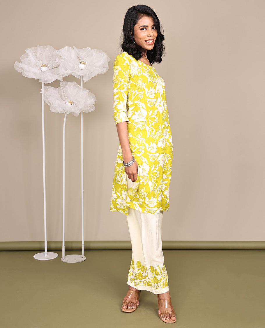 Green Cotton Ready-Made Suit, Featuring Silhouette-Style Floral Prints, a Round Neckline, 3/4 Sleeves, and Straight-Cut Top, Paired with Floral-Printed Straight-Cut Pants