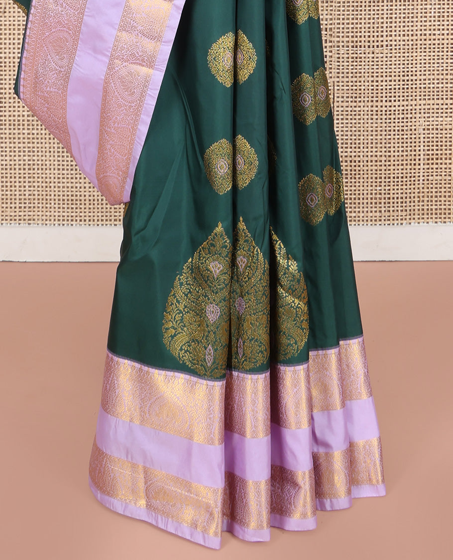 Green Budget Silk Saree, Gracefully Embellished with Meena Buttas All Over Its Body, Complemented by Contrast Traditional Zari Design Rettai Pettu Border, Intricately Designed Pallu, and Paired with a Contrast Blouse