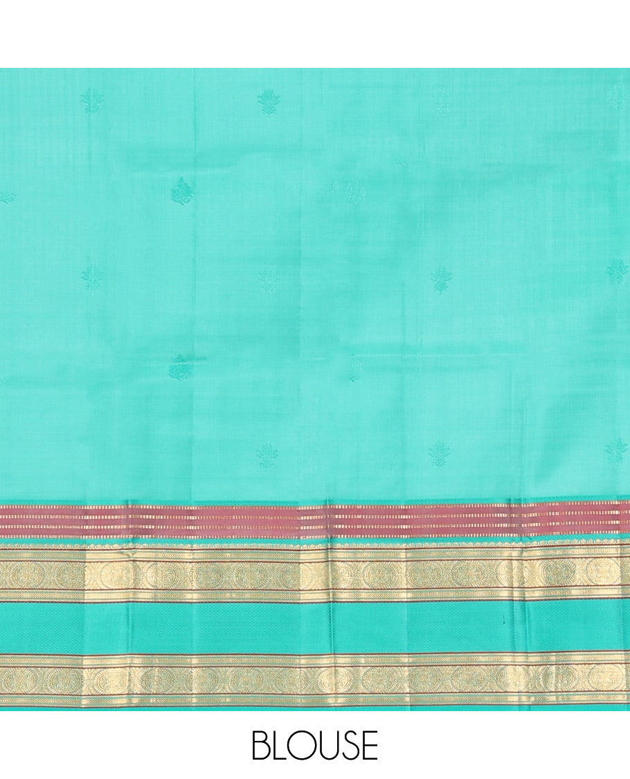 Purple Vasundhara Silk Saree, Beautifully Bedecked with Kamalam Buttas on Its Body, Complemented by a Captivating Contrast Border of Muthu, Chakram, and Mayil Kann Designs, Grand Jaal Pallu, and Paired with a Contrast Blouse