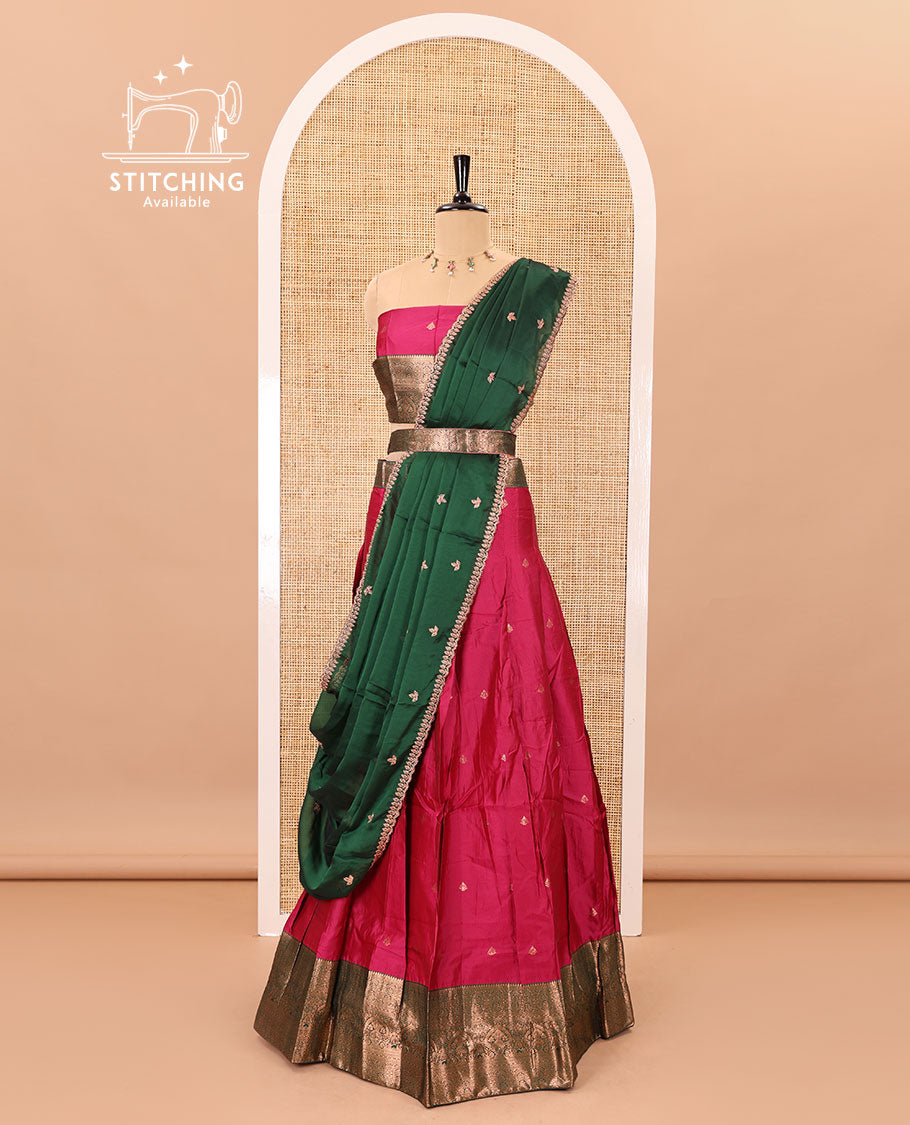 Rani pink taffeta silk half-saree, zari buttas with contrast traditional zari bordered skirt, matching zari design blouse, and contrast scallop buttas embroidered dhavani