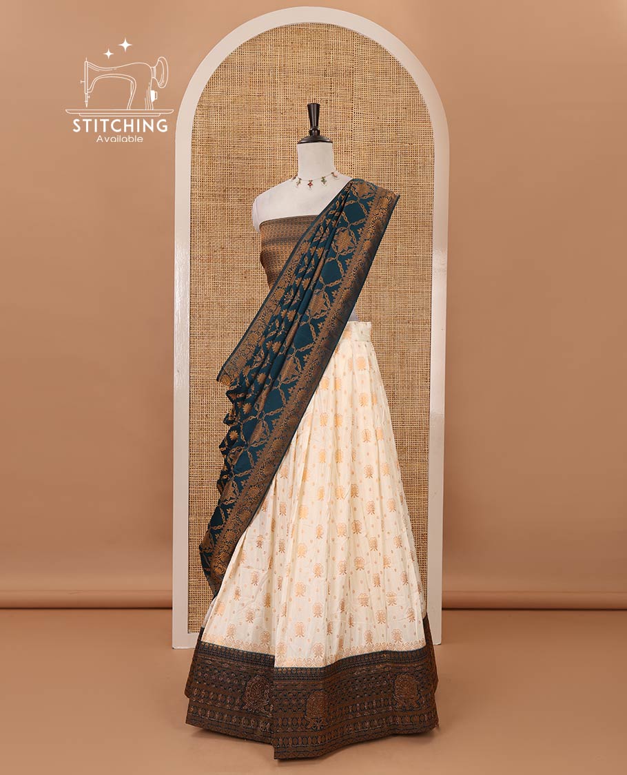 Cream semi-banaras half-saree, zari buttas & contrast Swarovski stonework traditional border skirt, jacquard blouse & contrast jaal jacquard peacock blue dhavani