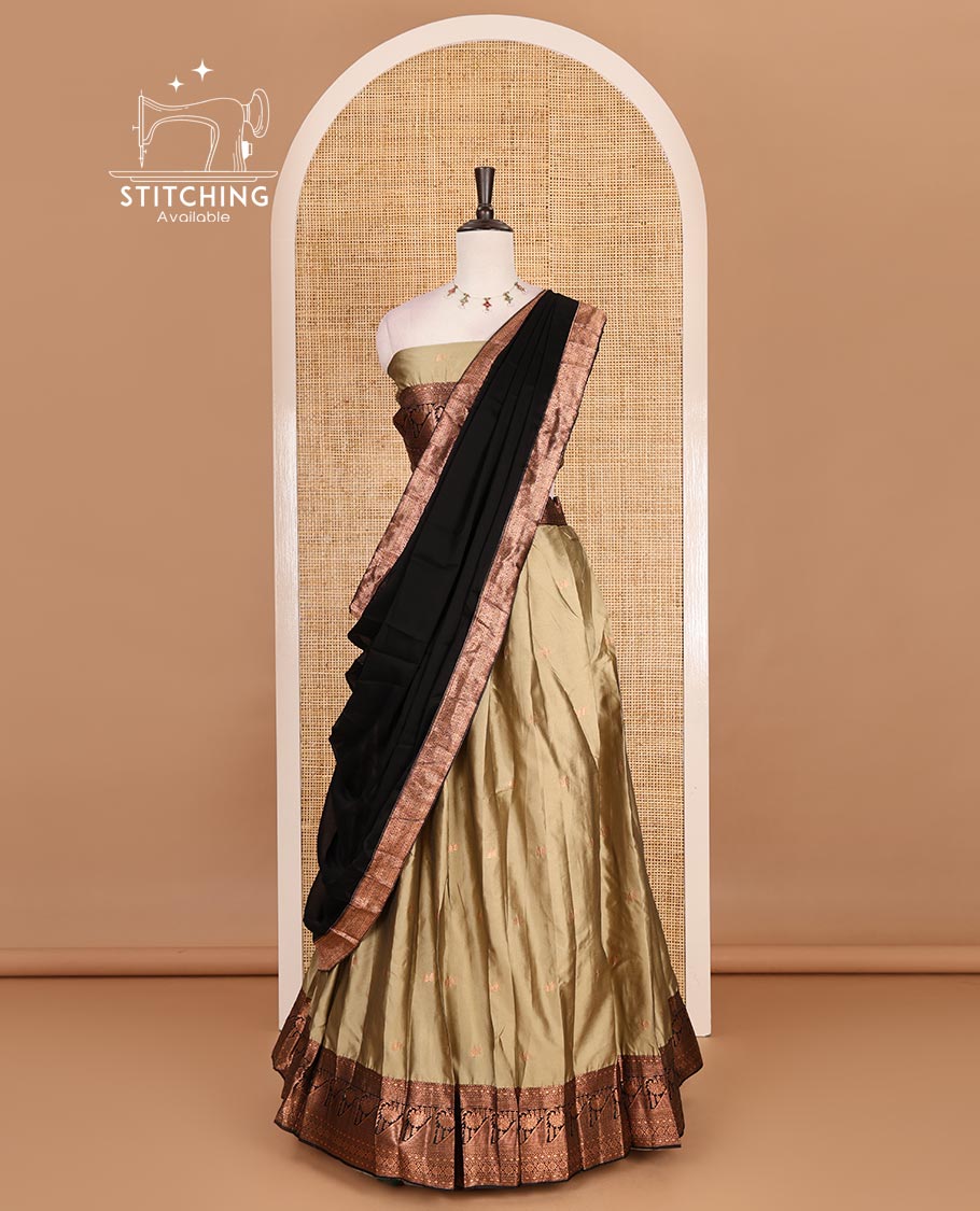 Brown taffeta silk half saree, zari buttas with contrast black traditional zari border skirt, matching zari design blouse, and contrast plain zari border syska georgette dhavani