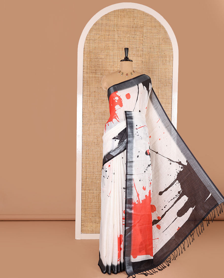 White colorful paint splashes printed linen cotton saree, contrast bavanji border, paint splashes printed pallu, and a contrast ajrakh printed blouse