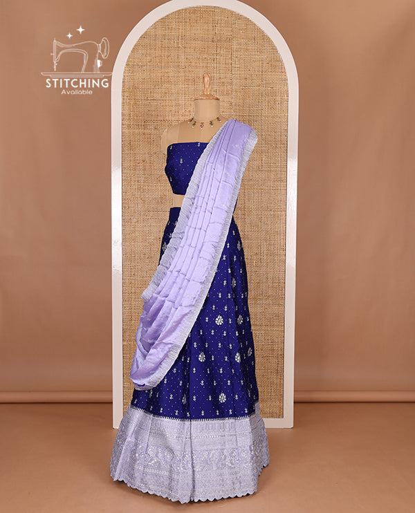 Blue half-saree, floral motifs embroidered semi raw silk top, matching embroidered blouse, and contrast scallop embroidered georgette dhavani