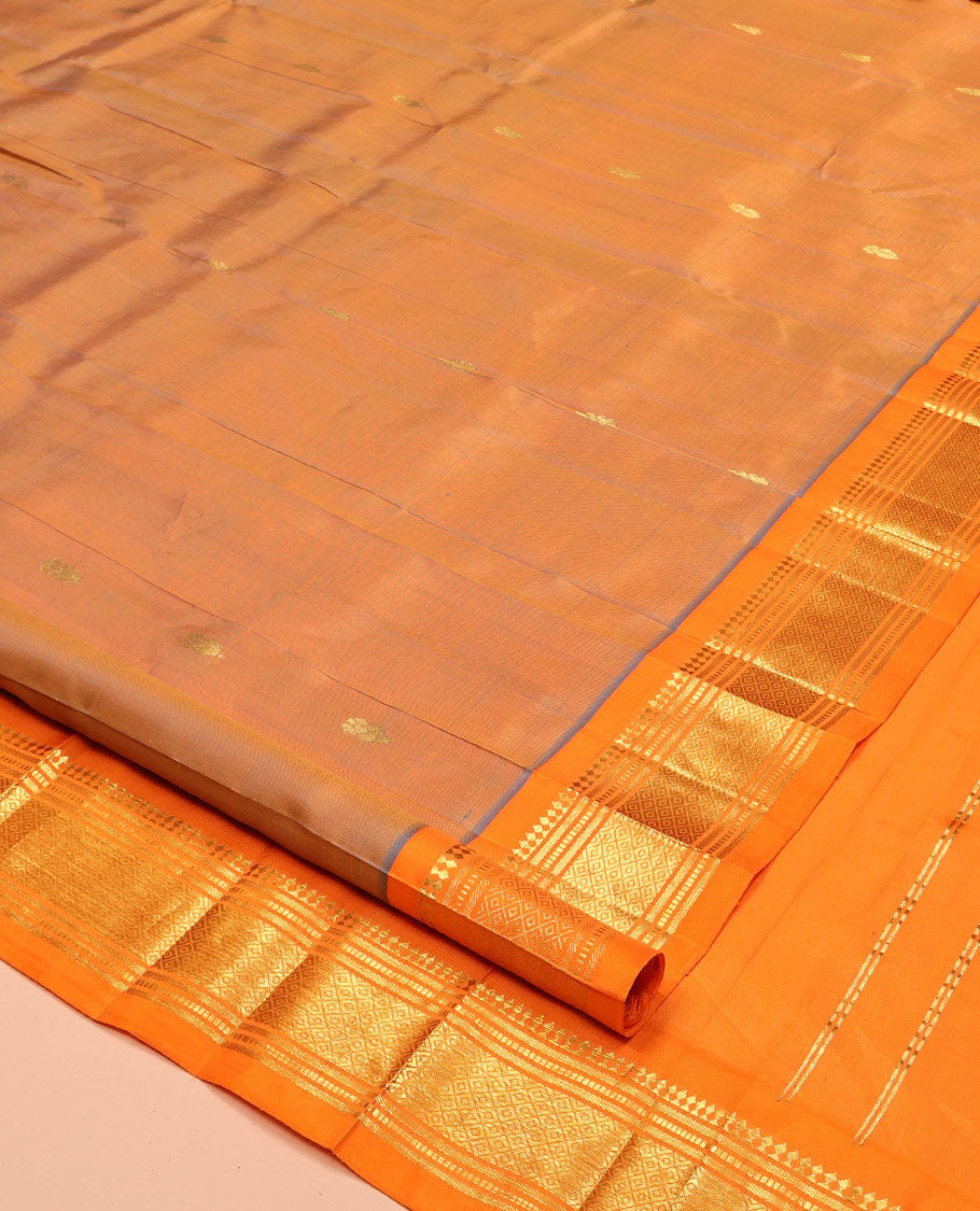 Orange Kanchipuram Silk Saree, Decorated with Zari Buttas, Complemented by a Contrast One-Sided Border of Panner Sombu, Banaras, Muthu, and Jaal Designs, Grand Pallu, and No Blouse