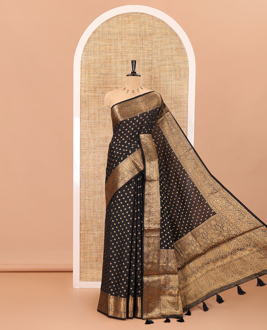 Black zari buttas woven semi tussar saree, zari intricate floral design border, zari-rich intricate pallu, and a plain blouse