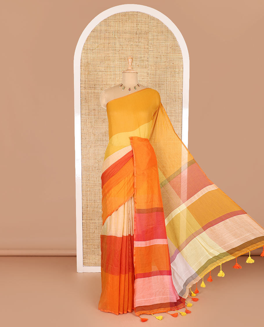 Borderless orange ombre-colored striped Khadi mul cotton saree, multi-colored tasseled pallu, and a matching blouse