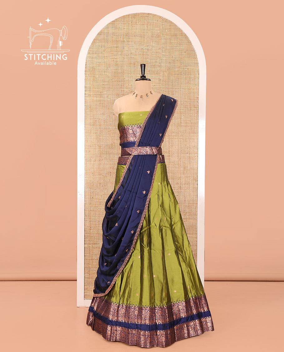 Parrot Green and Blue Semi-Banarasi Half-Saree, Accentuated with Zari Buttas on Its Skirt, Complemented by a Contrast Rettai Pettu Traditional Zari-Design Border, Paired with a Matching Blouse, and Comes with a Contrast Satin Georgette Embroidered Dhavani