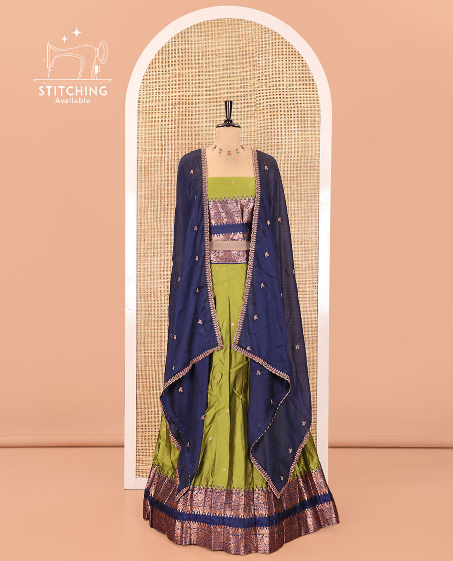 Parrot Green and Blue Semi-Banarasi Half-Saree, Accentuated with Zari Buttas on Its Skirt, Complemented by a Contrast Rettai Pettu Traditional Zari-Design Border, Paired with a Matching Blouse, and Comes with a Contrast Satin Georgette Embroidered Dhavani