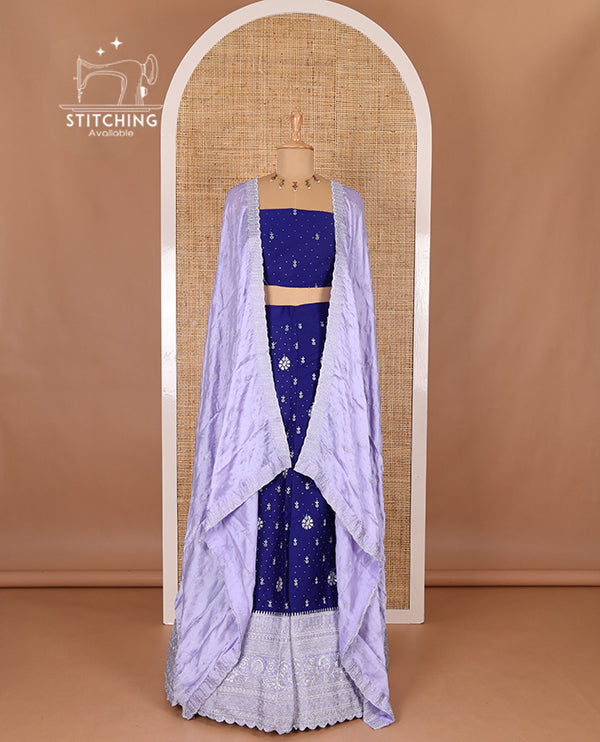 Blue half-saree, floral motifs embroidered semi raw silk top, matching embroidered blouse, and contrast scallop embroidered georgette dhavani