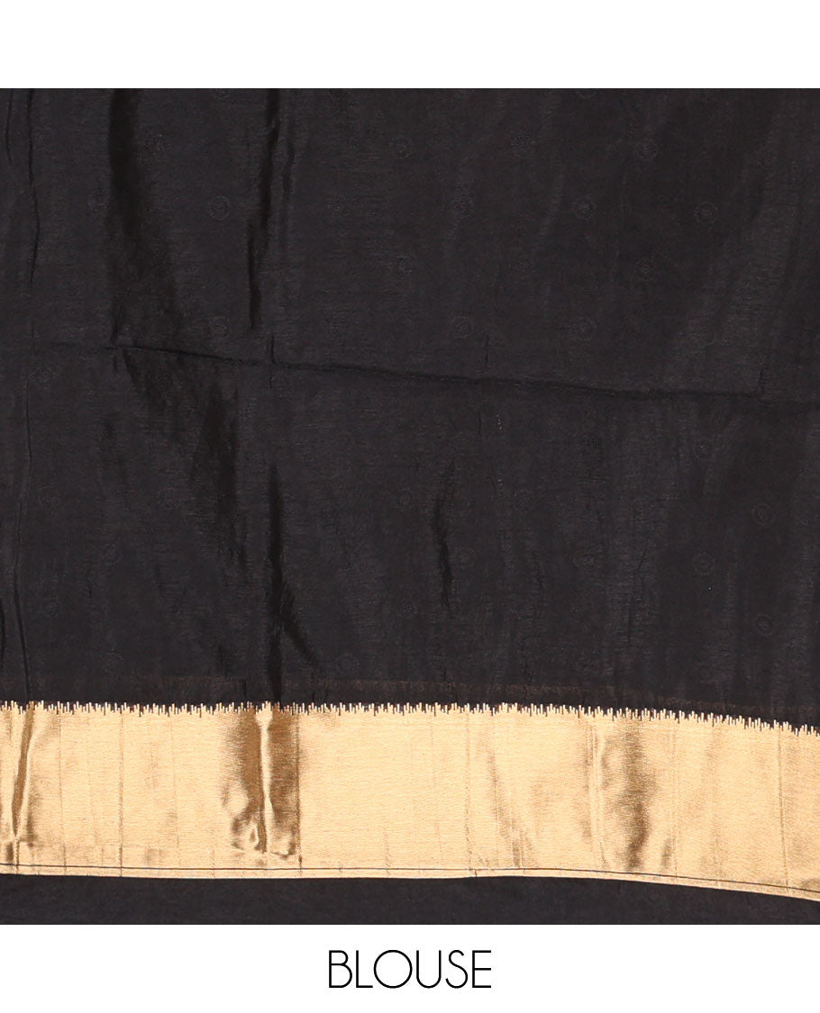 Black zari buttas woven semi tussar saree, zari intricate floral design border, zari-rich intricate pallu, and a plain blouse