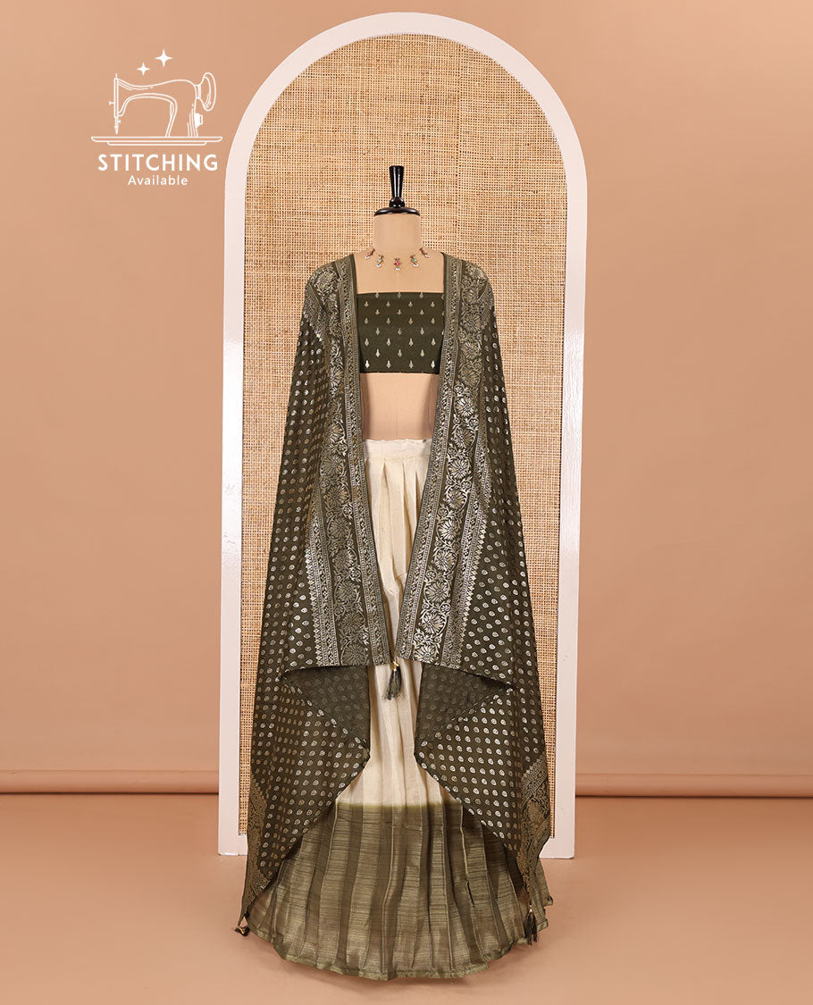 Cream-olive green Vichitra half-saree, plain and contrast bordered skirt, contrast leaf buttas blouse, dhavani of buttas and floral creeper designs