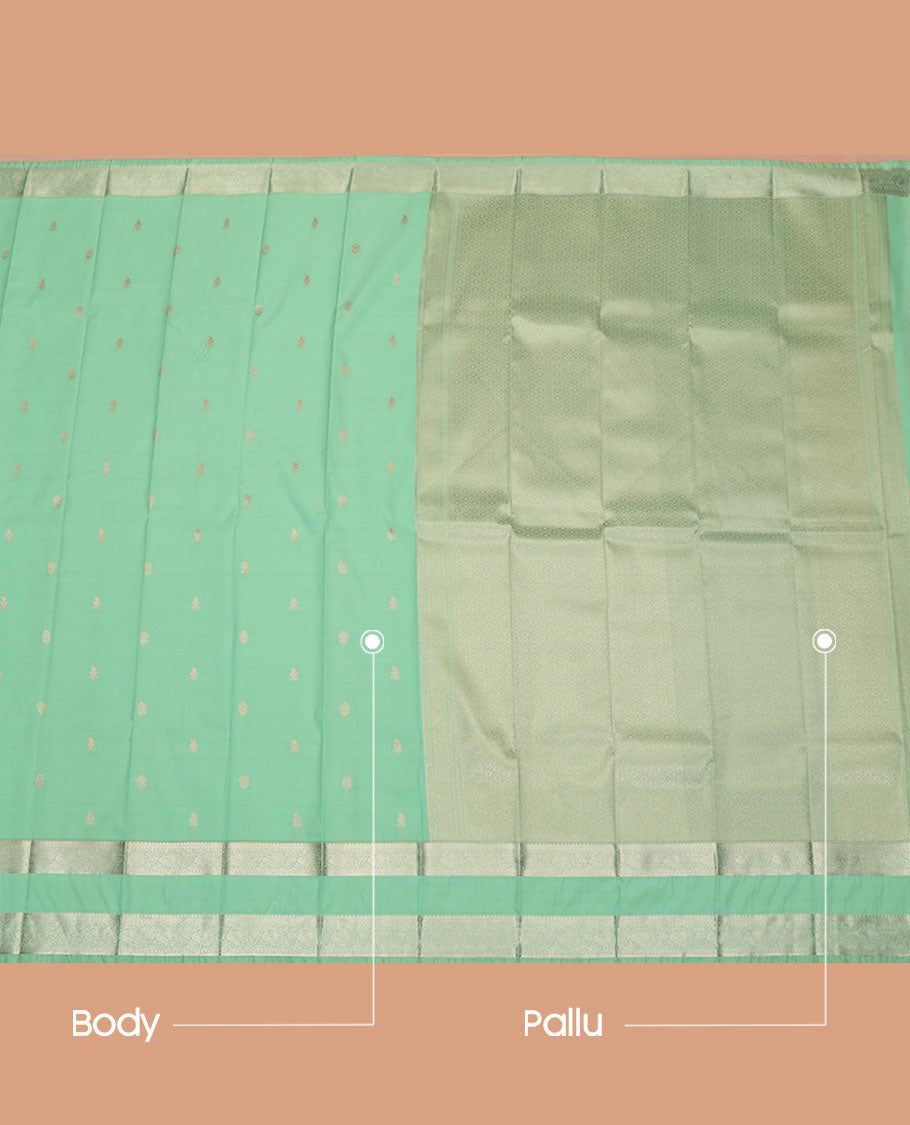 Green Budget Silk Saree, Accentuated with Zari Buttas All Over Its Body, Highlighted by Rettai Pettu Traditional Zari Design Border of Peacocks, Intricately Designed Jaal Pallu, and Paired with a Matching Blouse