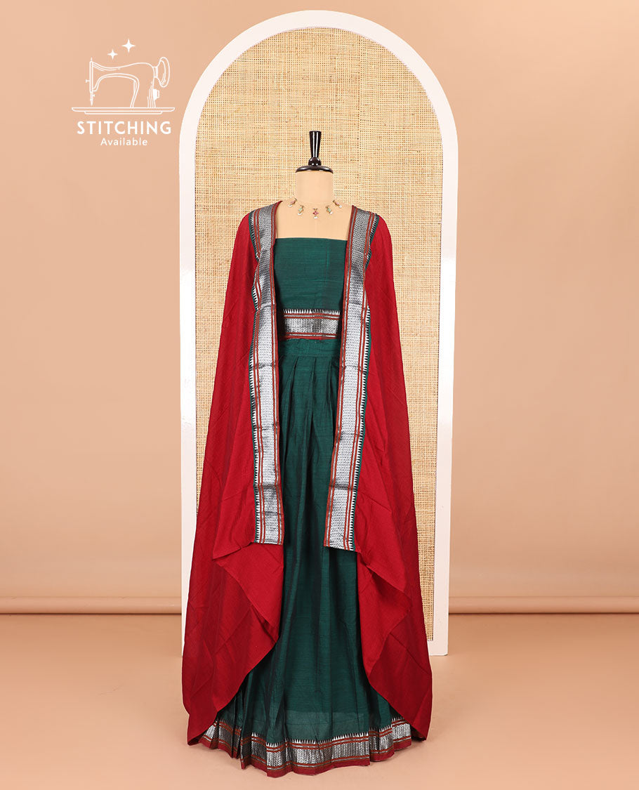 Dark green half-saree, plain with contrast traditional zari bordered skirt, matching blouse, and contrast zari border dhavani