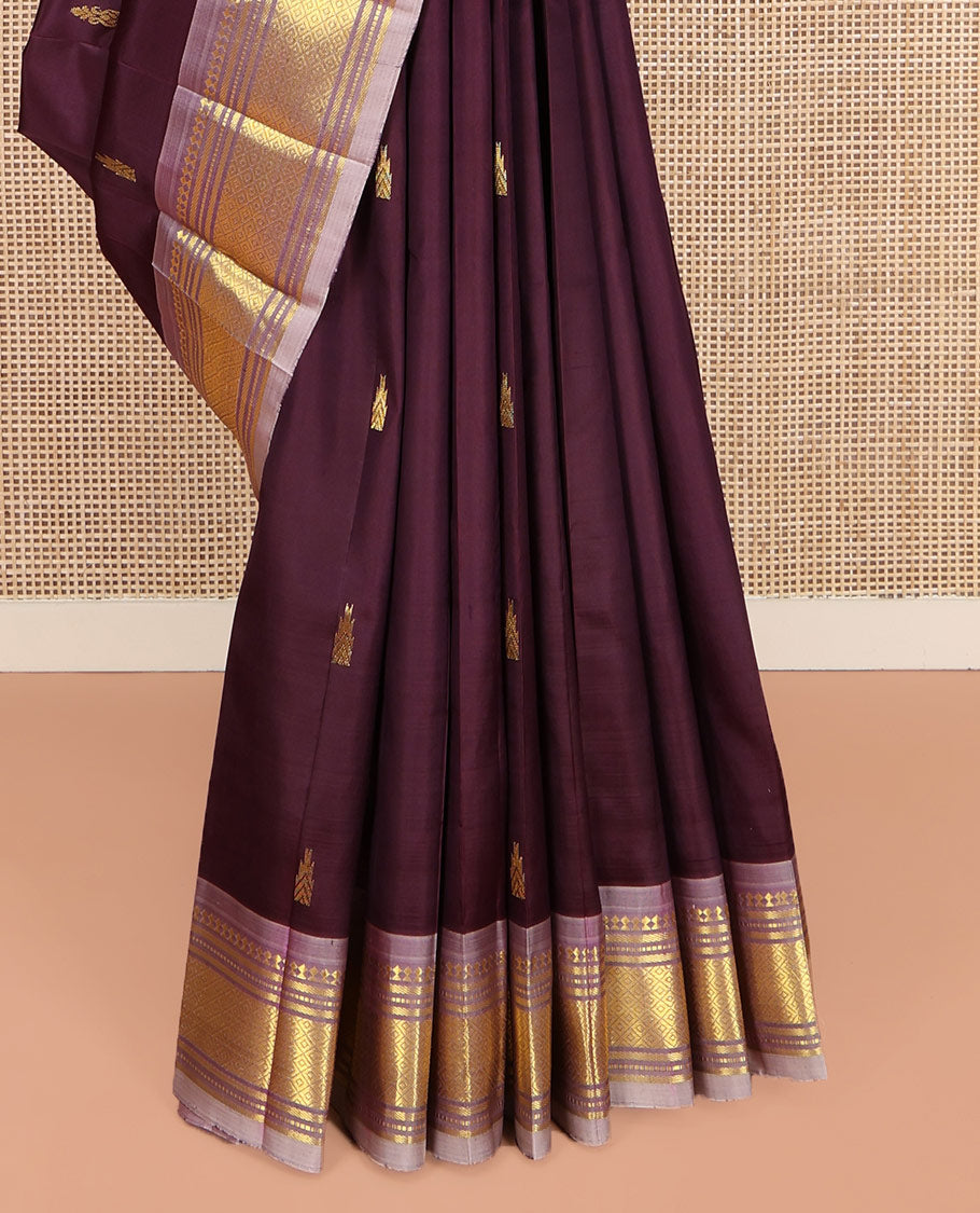 Brown Kanchipuram Silk Saree, Ornamented with Thazampoo Rekku Zari Buttas on Its Body, Complemented by Contrast One-Sided Border of Panner Sombu, Banaras, Muthu, and Mayil Kann Designs, Pallu Features Zari Designs, and Comes Without a Blouse