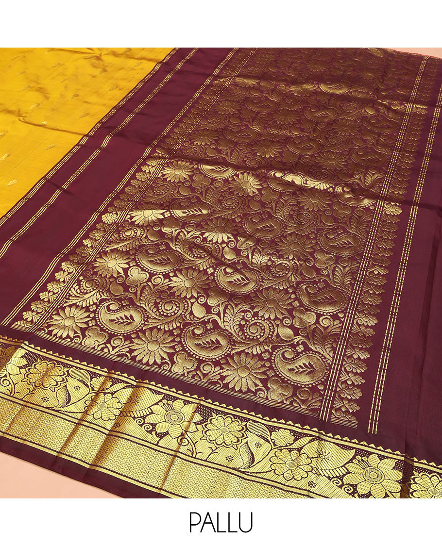 Mustard Kanchipuram Silk Saree, Decorated with Zari Buttas, Complemented by Contrast One-Sided Korvai Border of Rekku, Banaras, Floral and Mayil Kann Designs, Pallu of Floral-Paisley Designs, and Comes Without a Blouse
