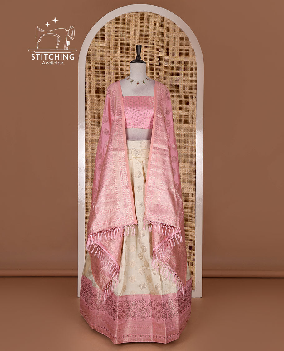 Cream and onion pink semi-banarasi half-saree, zari buttas with contrast swarovski stone work border skirt, contrast zari buttas blouse, and intricate zari dhavani