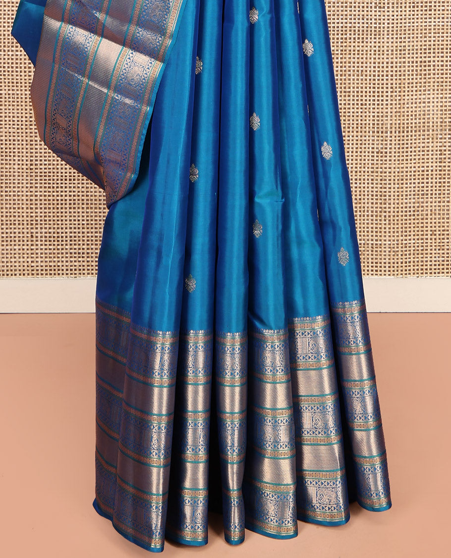 Blue Vasundhara Lite Silk Mix Saree Features Zari Buttas, a Zari Border of Kamalam, Ara Maadam, and Yaali, Pallu of Butta Enclosed Checks, and a Matching Blouse