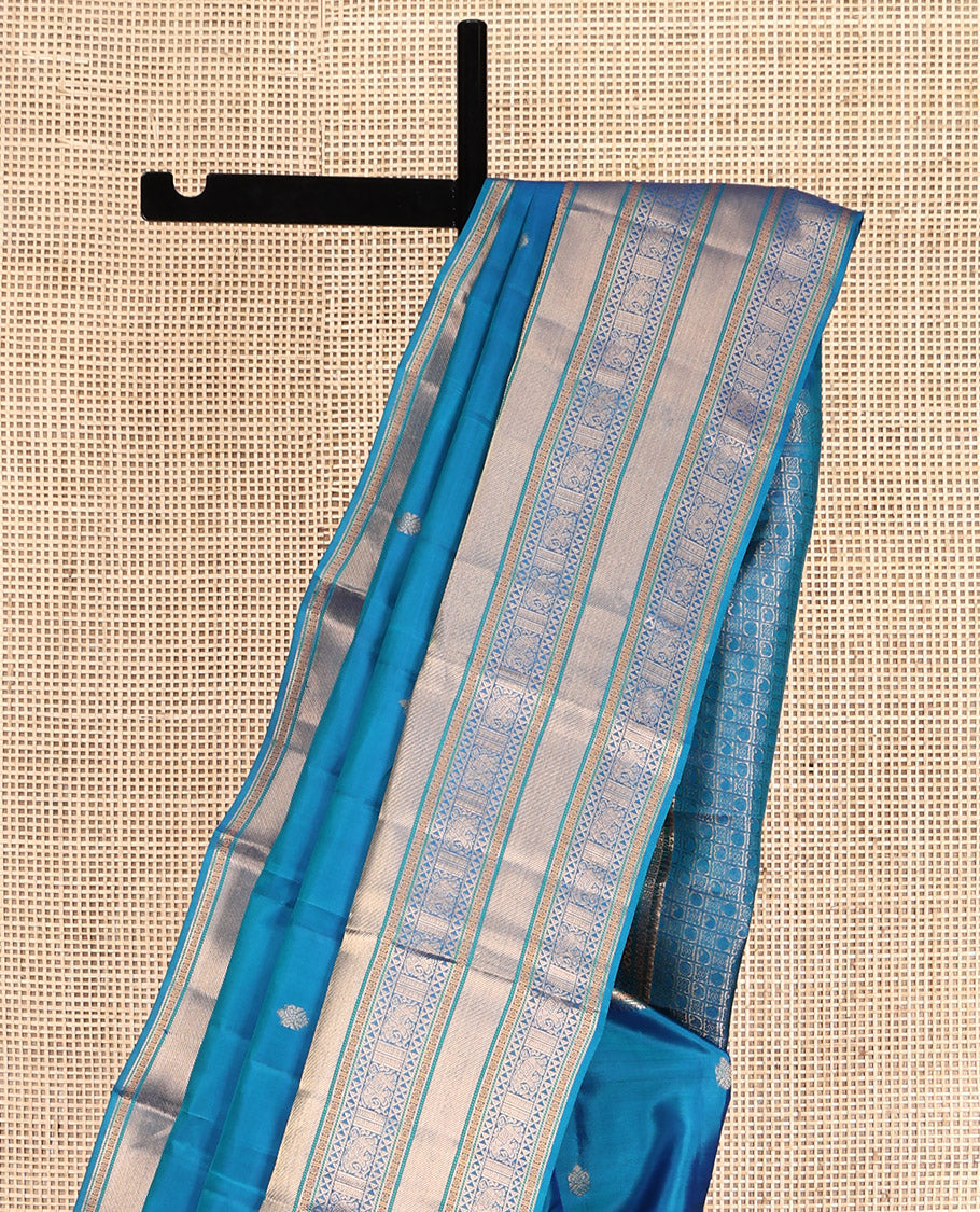 Blue Vasundhara Lite Silk Mix Saree Features Zari Buttas, a Zari Border of Kamalam, Ara Maadam, and Yaali, Pallu of Butta Enclosed Checks, and a Matching Blouse