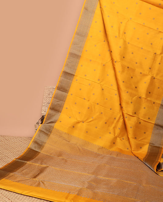 Yellow round buttas kancheepuram silk saree with self zari design border & in tricate zari design border