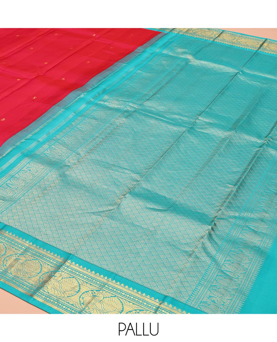 Red Vasundhara Silk Saree, Sparsely Woven with Zari Buttas All Over Its Body, Complemented by a Contrast Border of Rekku, Banaras, Diamond, and Round Mayil Designs, Grand Jaal-Patterned Pallu, and Paired with a Contrast Blouse