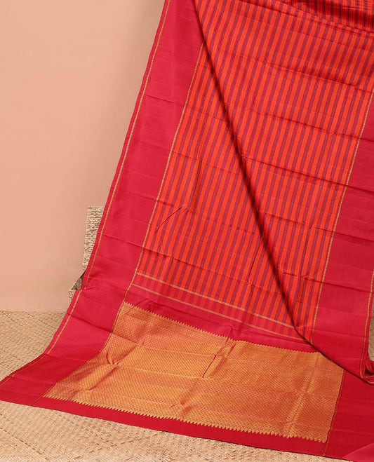 Red striped kancheepuram silk saree  with contrast rettai pettu border & pallu of argyle pattern