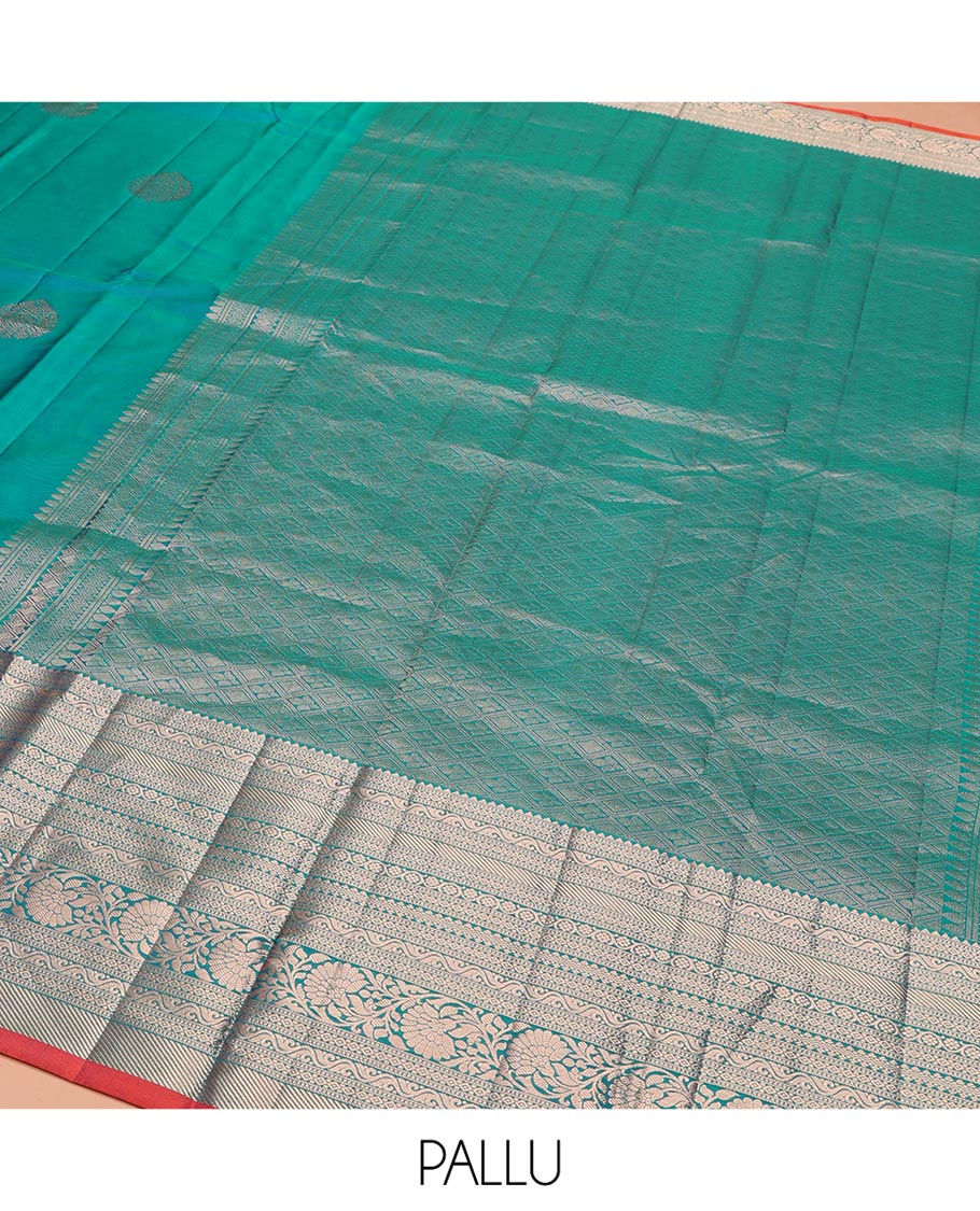 Blue Vasundhara Silk Saree, Accentuated with Zari Buttas on Its Body, Highlighted by a Zari Border of Rekku, Muthu, Diamond, and Kodi Visiry Designs, Grandly Woven Jaal Pallu, and Paired with a Matching Blouse
