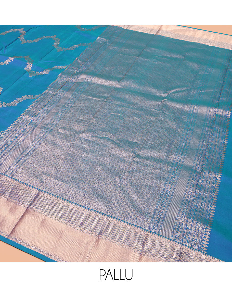 Blue Vasundhara Silk Saree, Delicately Woven with Jaal Jacquard Design All Over Its Body, Highlighted by a Zari Border of Thilakam Mokku, Jaal, and Lavangam Designs, Grand Jaal Pallu, and Paired with a Matching Blouse