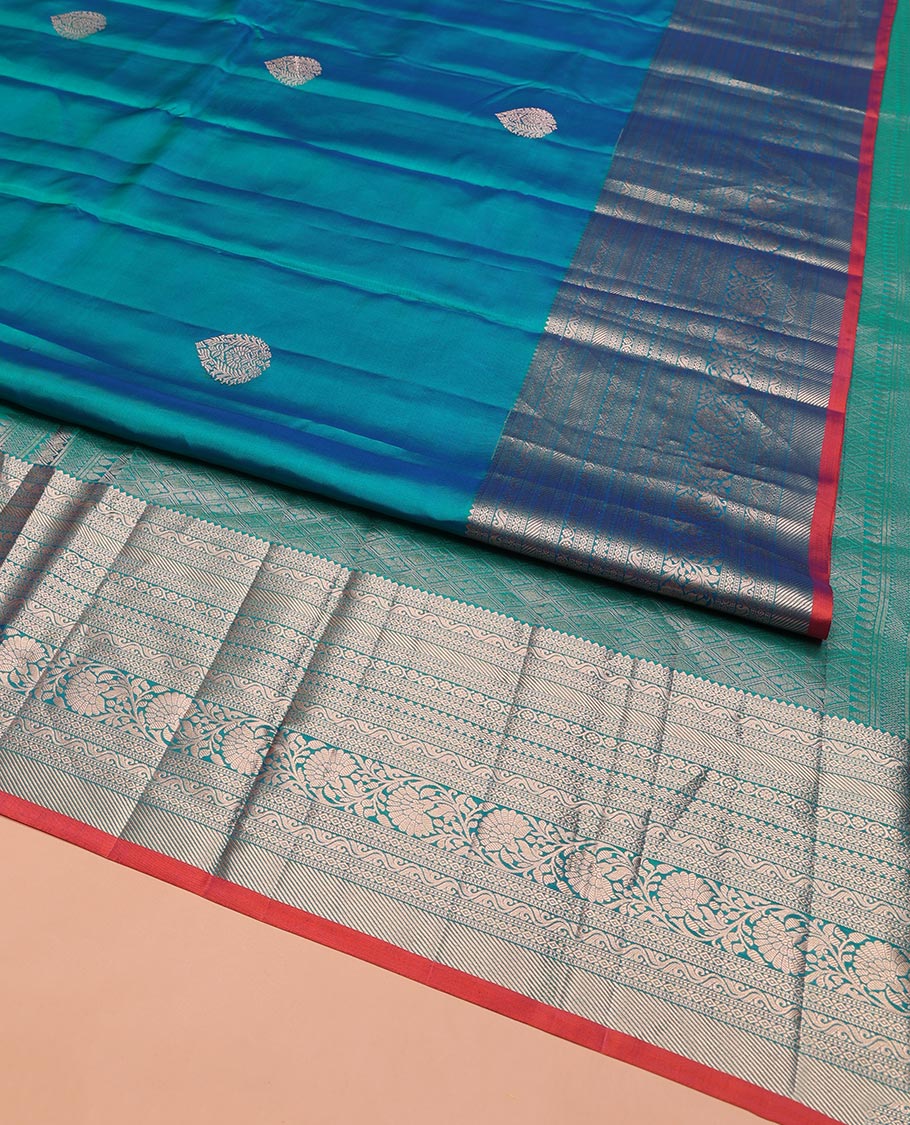 Blue Vasundhara Silk Saree, Accentuated with Zari Buttas on Its Body, Highlighted by a Zari Border of Rekku, Muthu, Diamond, and Kodi Visiry Designs, Grandly Woven Jaal Pallu, and Paired with a Matching Blouse