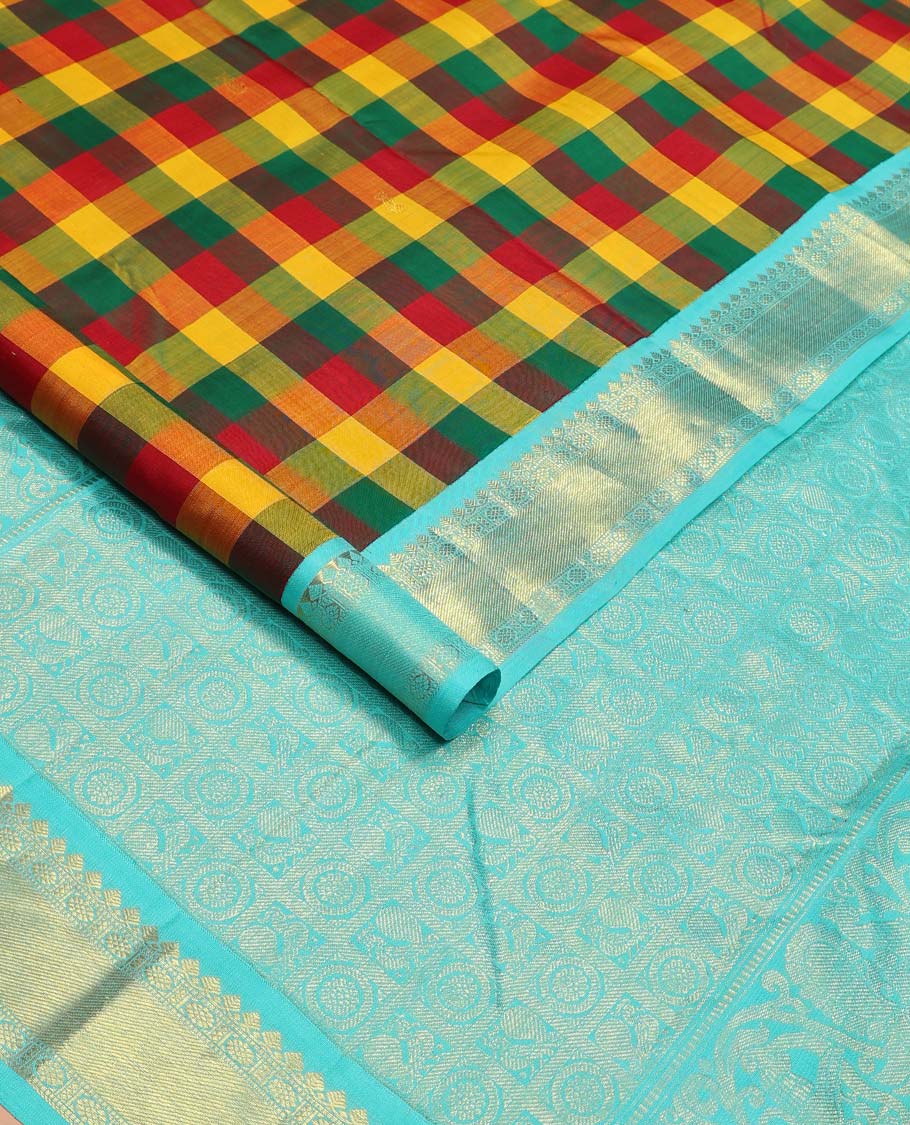 Multi-color paalum pazhamum checks, and buttas Kanchipuram korvai silk saree, contrast korvai border of thilakam mokku, muthu, and laddu kamalam, and annam chakram enclosed pallu